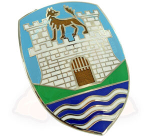 Insignia del capó con el emblema 'Castillo de Wolfsburg' sobre fondo azul, Escarabajo 4/1951-7/1959